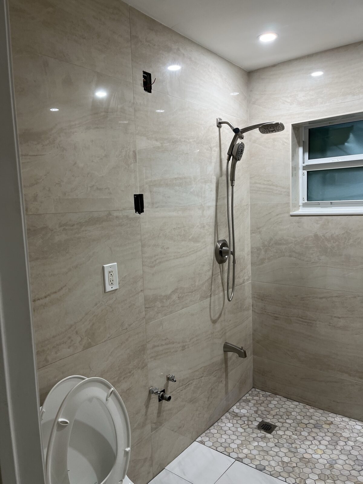 Bathroom remodel with porcelain tile and recessed lighting, Miami