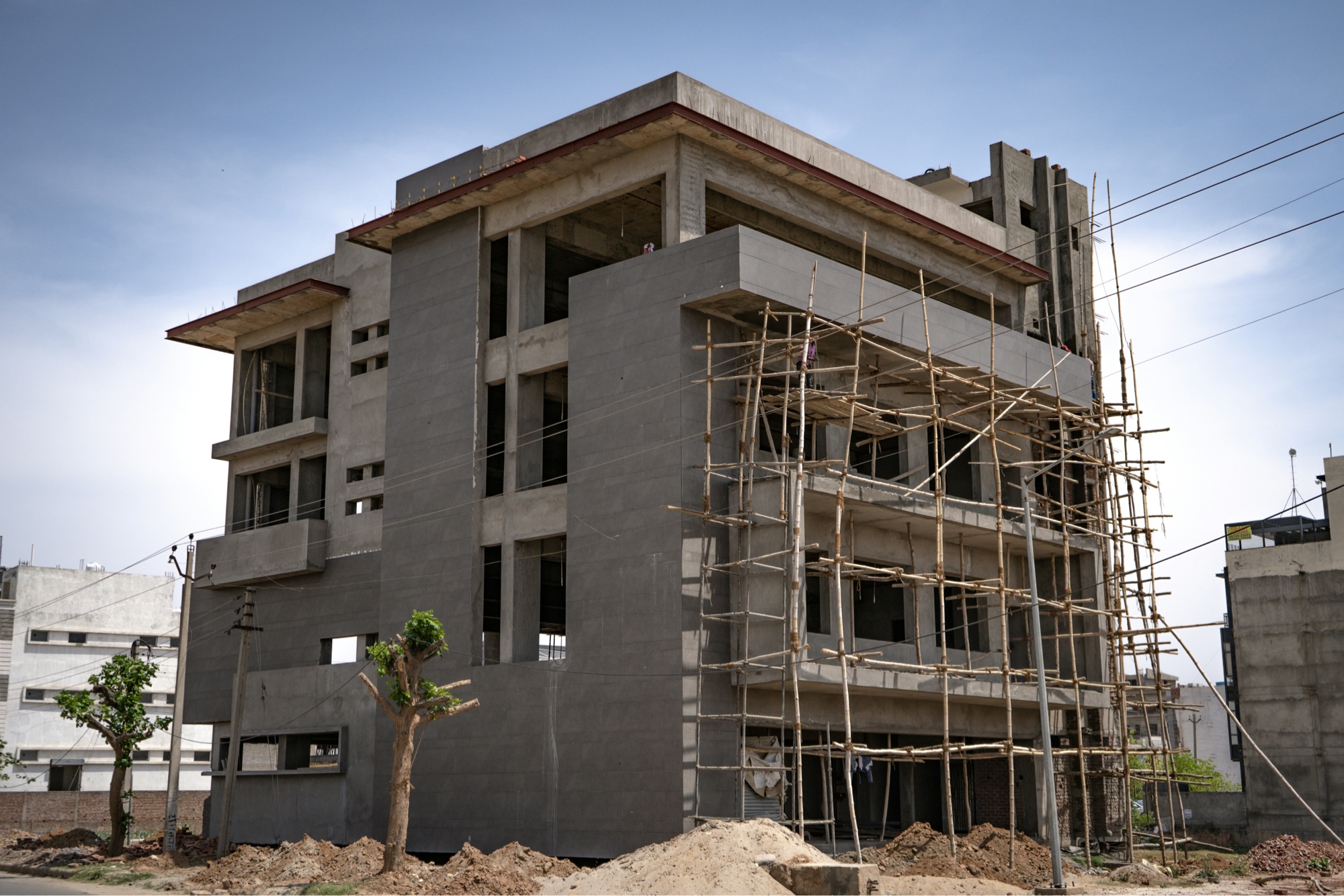 Multi-story building under construction with scaffolding