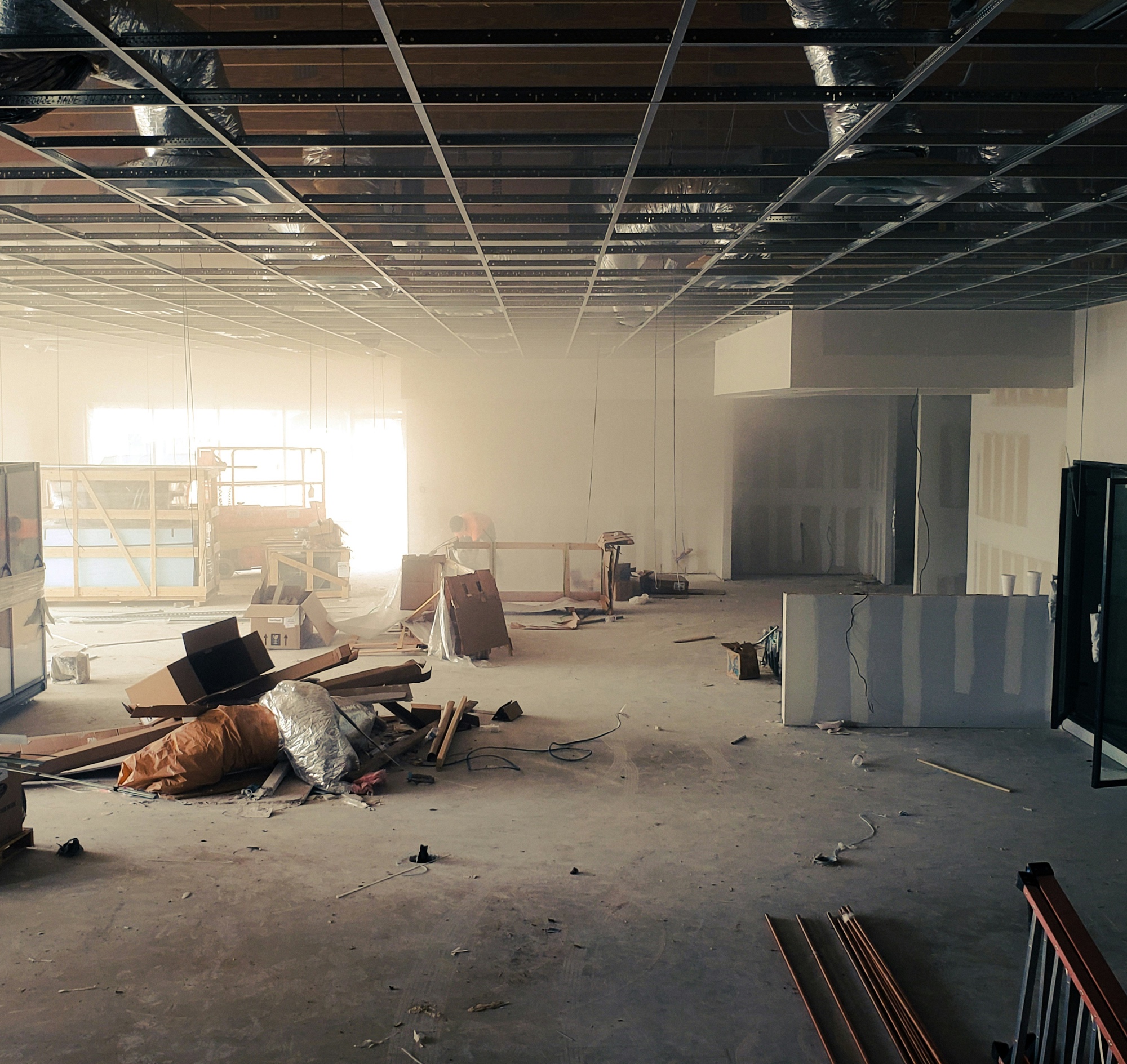 Commercial interior build-out — open floor plan with MEP rough-in
