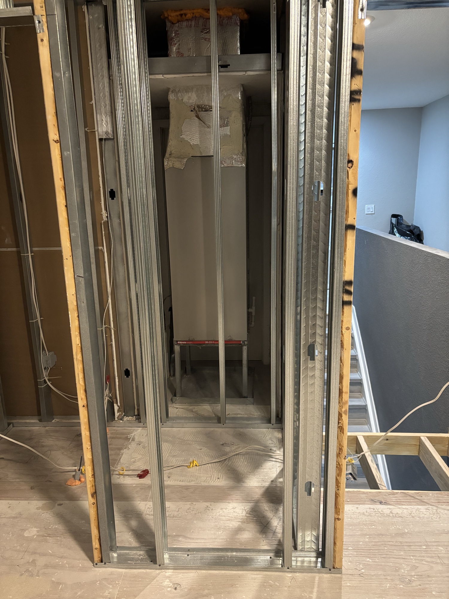Residential interior renovation — steel stud framing and insulation