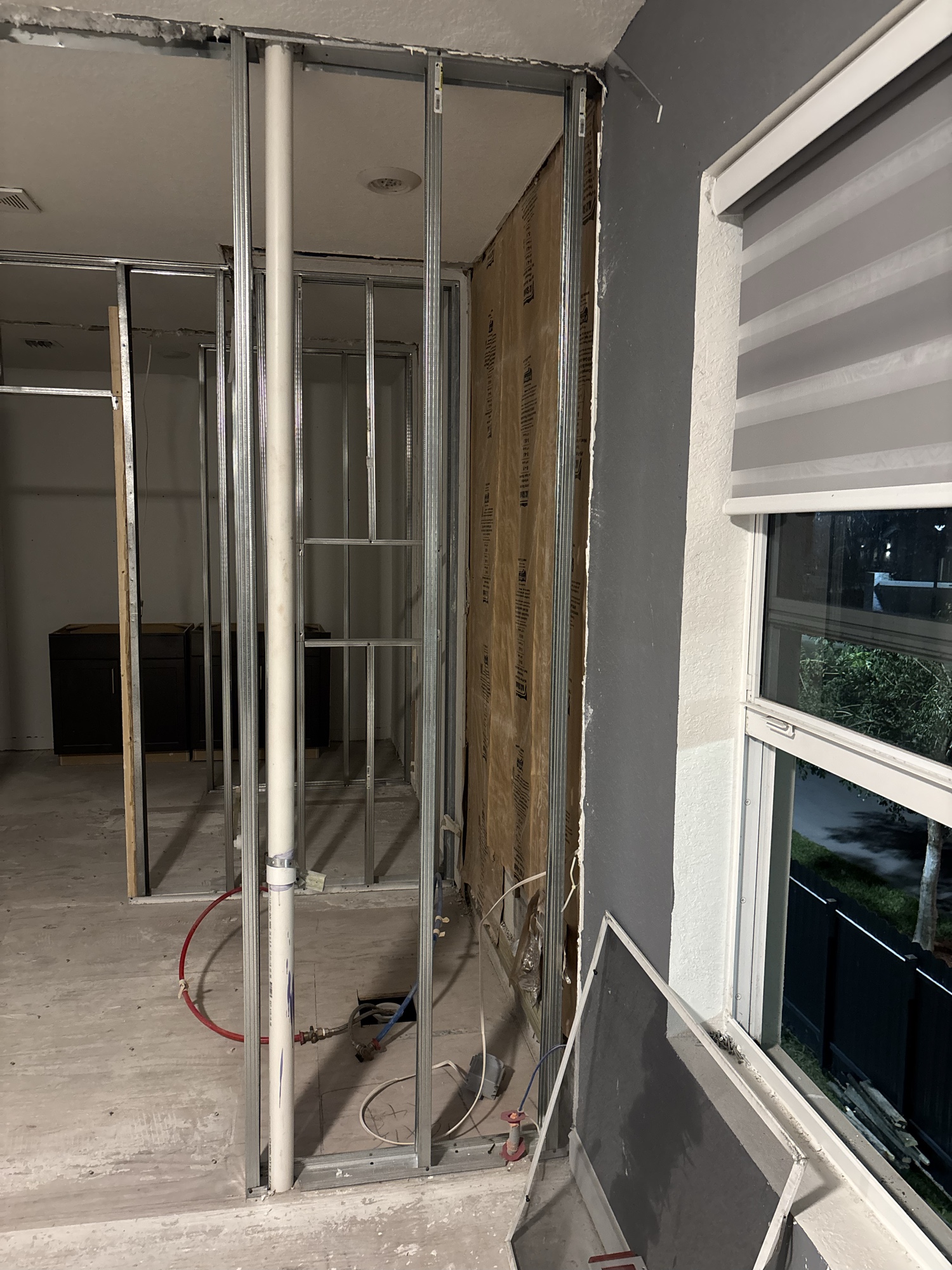 Residential renovation — steel stud framing with plumbing rough-in