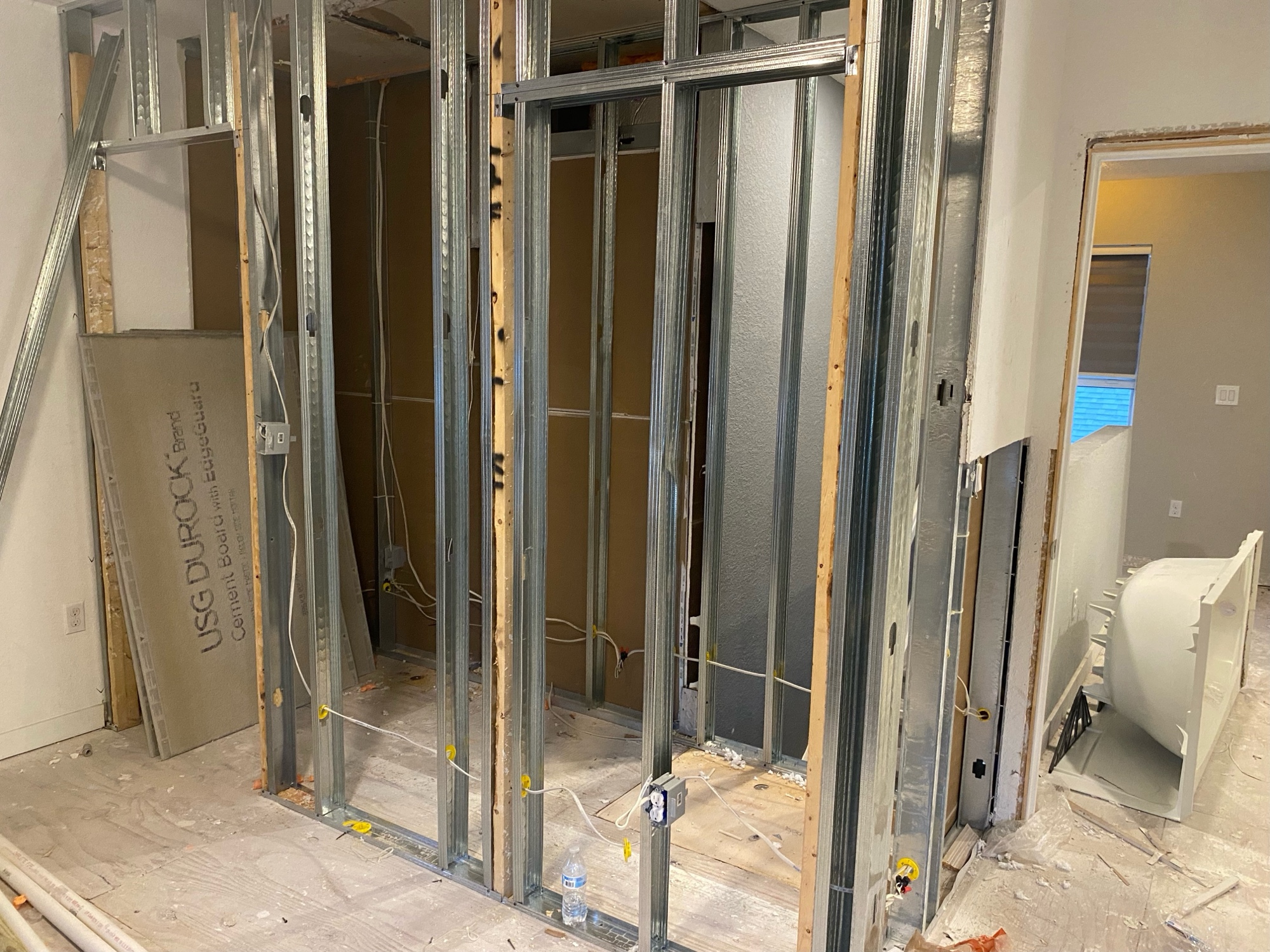 Full gut renovation — new steel stud walls with cement board
